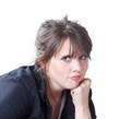 Young woman with head on her fist; head and shoulders