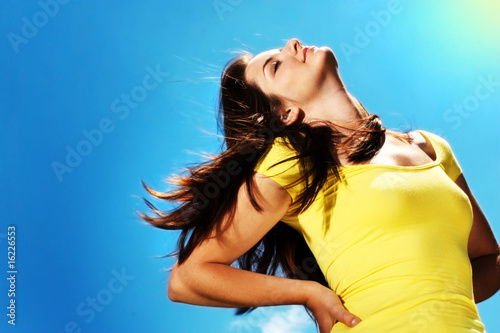Photo: Beautiful woman enjoying the sun Beautiful woman enjoying the sun