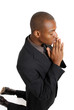 Business man praying on his knees Business man praying on his knees