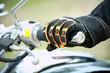 Biker hand rests on the steering wheel motorcycle Biker hand rests on the steering wheel motorcycle