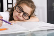 little girkl teiered of doing homework
