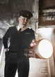 Security guard shining flashlight into bunker