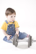 small boy with dumbbell