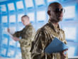 Man in camouflage holding folder