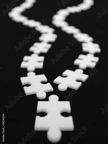 Photo: Converging curved lines of puzzle pieces Converging curved lines of puzzle pieces
