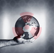 Man holding globe with overlay of nuclear symbol
