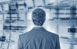 Businessman with computer screen in background