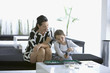 Woman playing backgammon with daughter