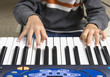 Photo: Close up of boy playing keyboard Close up of boy playing keyboard