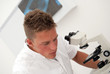 male lab technician looking at test results