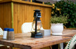 Street cafe table with old style petrol-lamp on it