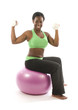 young pretty hispanic african american woman exercising with fit