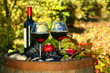 Glasses of red wine on old barrel