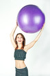 Young woman on white background in a fitness pose Young woman on white background in a fitness pose