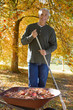 Man doing yard work in autumn