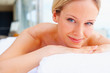 Cute young woman relaxing at a dayspa