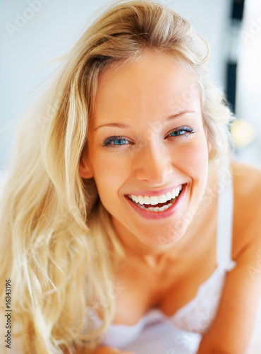 Closeup portrait of a cute young female smiling Closeup portrait of a cute young female smiling