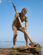 Primeval man catches a fish
