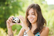 Young lady taking photos outdoors Young lady taking photos outdoors