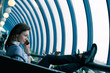 Photo: The brunette young girl speaks by phone being in cafe The brunette young girl speaks by phone being in cafe