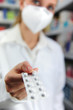 pharmacist with mask selling medicine pharmacist with mask selling medicine