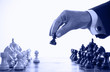 businessman playing chess game blue tone