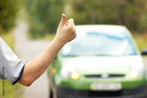 Man hitching on road Man hitching on road