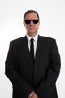 man in black suit posing in studio man in black suit posing in studio