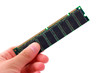 Photo: Hand holding computer ram isolated on white background Hand holding computer ram isolated on white background