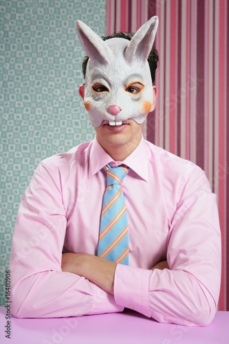 Photo: Businessman with funny rabbit mask Businessman with funny rabbit mask