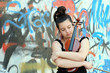 beautiful young woman holding violin