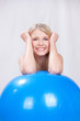 Attractive blue eye girl behid pilate ball
