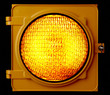 Illuminated amber traffic light