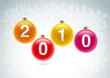 2010 christmas balls on snowflake background.