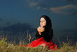 Photo: Little muslim girl on meadow, before sunset Little muslim girl on meadow, before sunset