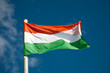 Hungarian flag against blue sky