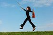 girl with violin jumps on grass against sky girl with violin jumps on grass against sky