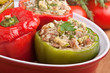 stuffed peppers in a red dish