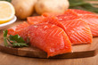 three salmon pieces on a chopping board