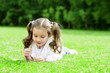 Child lying on the grass