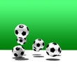 soccer balls on green background