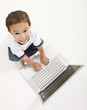 Photo: A young boy working on his laptop A young boy working on his laptop