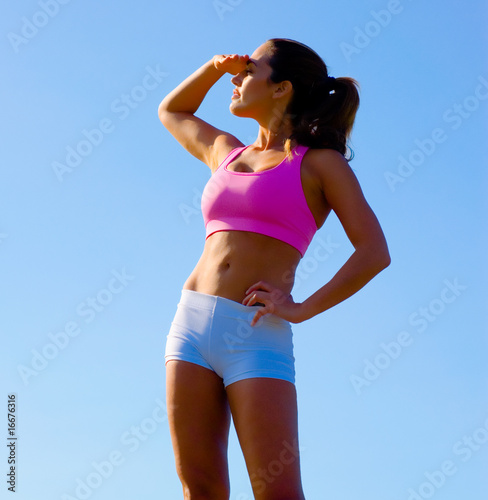 Photo: Athletic Woman Exercising Athletic Woman Exercising
