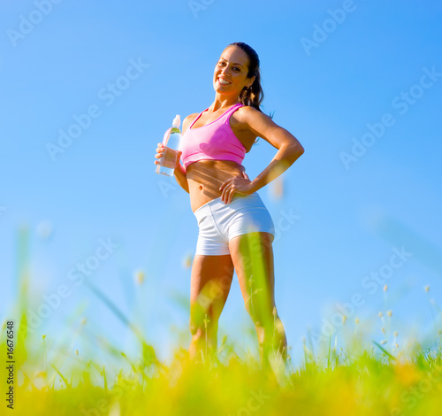 Photo: Athletic Woman Exercising Athletic Woman Exercising