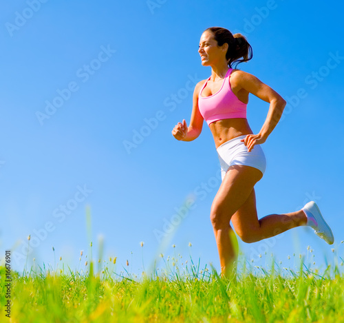 Photo: Athletic Woman Exercising Athletic Woman Exercising