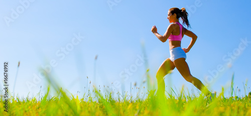 Photo: Athletic Woman Exercising Athletic Woman Exercising
