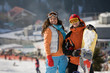 Photo: Lucky couple snowboarders in a mountain valley Lucky couple snowboarders in a mountain valley