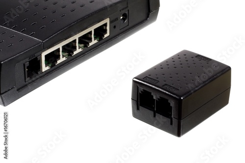 Photo: ADSL modem and phone line splitter isolated on white ADSL modem and phone line splitter isolated on white