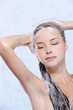 relaxation of young woman taking shower