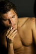 Young Sexy Man Smoking a cigarette